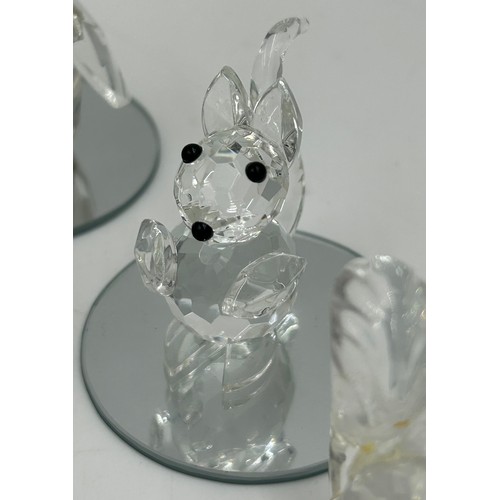 477 - A collection of Swarovski crystal animals etc. to include 2 x hedgehogs, owl, penguin, 3 x birds, 3 ... 