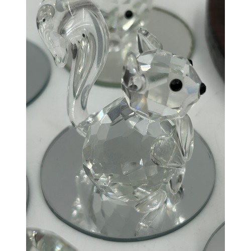 477 - A collection of Swarovski crystal animals etc. to include 2 x hedgehogs, owl, penguin, 3 x birds, 3 ... 