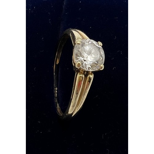 668 - A 14 carat QVC ring set with solitaire CZ. Size O/P. Weight 2.2gm.