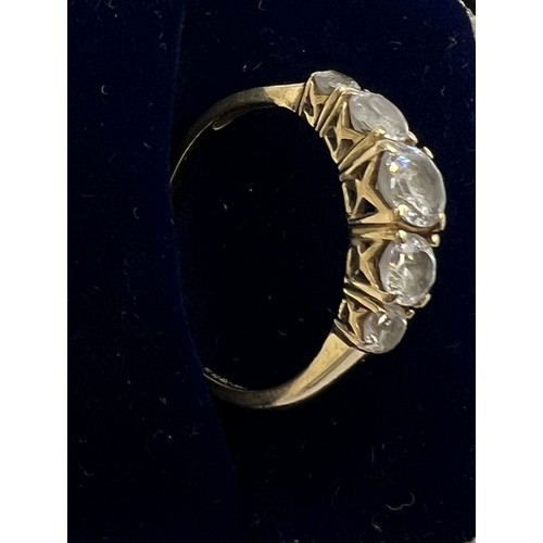 669 - A QVC 14 carat gold ring set with five CZ. Size P. Weight 2.1gm.