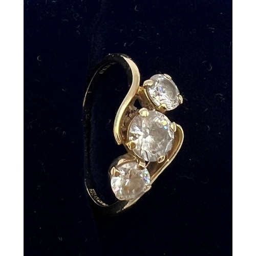 670 - A QVC 14 carat gold ring set with three CZ. Size K. Weight 1.8gm.