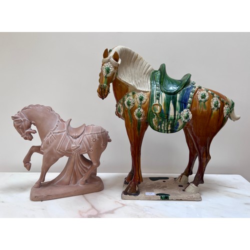 1054 - Two 20thC ceramic Tang horses. The larger coloured glazed horse with large chip to base, 63cm h x 59... 