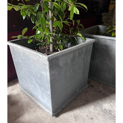 5 - Two good quality faux lead garden planters. Each 54 x 54 x 52cm h.