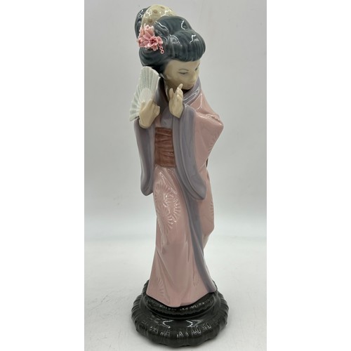 332 - Two Lladro Japanese Geisha figurines : Sayonara, model no. 4989 with parasol and Daisa Chrysanthemum... 