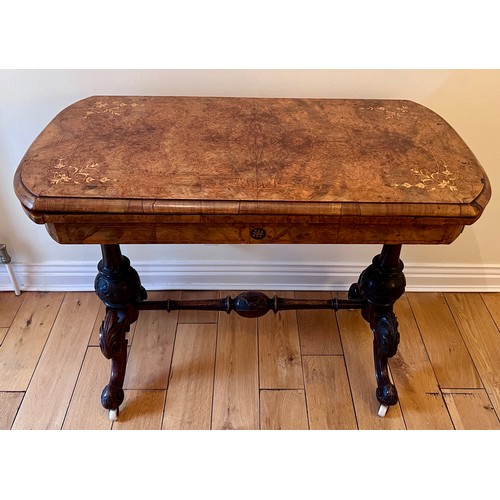 123 - A 19thC burr walnut fold over card table on ceramic castors with baize lined interior. 72cm h x 96cm... 