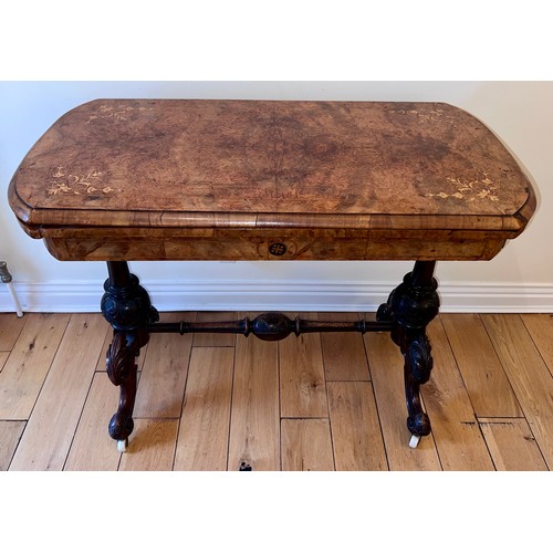 123 - A 19thC burr walnut fold over card table on ceramic castors with baize lined interior. 72cm h x 96cm... 