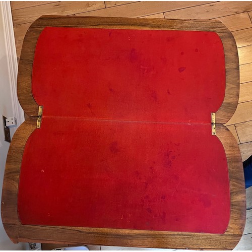 123 - A 19thC burr walnut fold over card table on ceramic castors with baize lined interior. 72cm h x 96cm... 