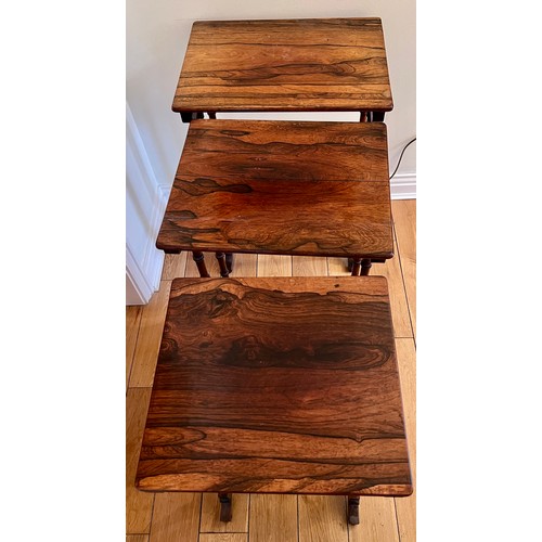 124 - A nest of three rosewood tables. Tallest 71cm h x 50cm w x 37cm d.