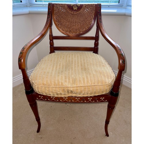 126 - A French style cane seated and painted armchair. Height to back 88cm x 55cm w.