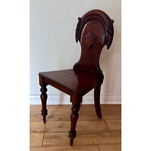 129 - A 19thC mahogany hall chair. Height to back of seat 87cm 42cm w x 44cm h to seat.