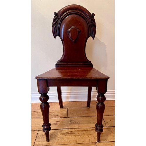 129 - A 19thC mahogany hall chair. Height to back of seat 87cm 42cm w x 44cm h to seat.