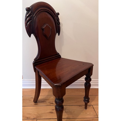 129 - A 19thC mahogany hall chair. Height to back of seat 87cm 42cm w x 44cm h to seat.