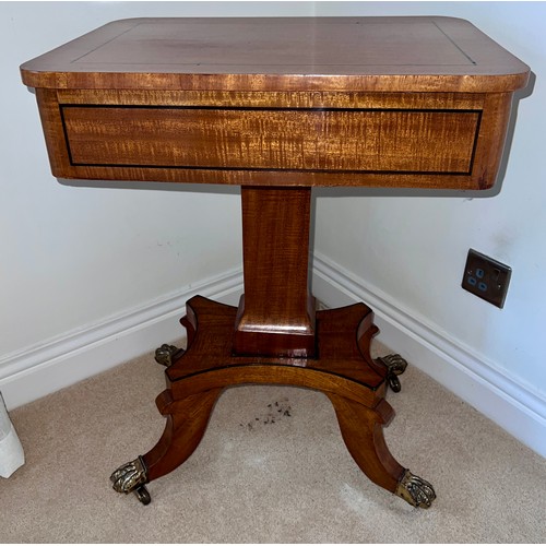 133 - Mahogany and inlaid side table with single drawer on brass claw feet and castors. 70cm h x 52.5cm w ... 