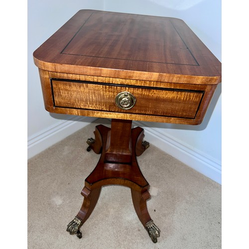 133 - Mahogany and inlaid side table with single drawer on brass claw feet and castors. 70cm h x 52.5cm w ... 