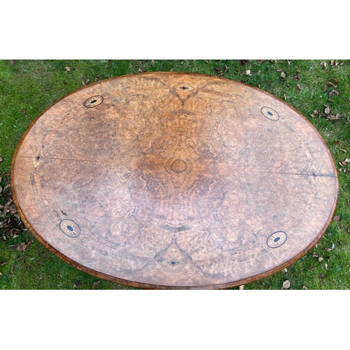 134 - A 19thC oval walnut and inlaid table 72cm h x 114cm w x 78cm d.