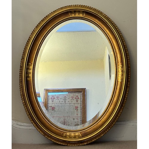 1156 - A contemporary oval gilt mirror 87 x 68cm.