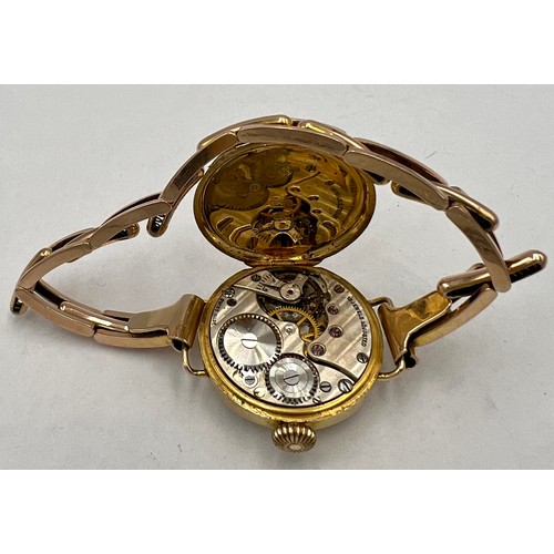 754 - A 9 carat gold ladies wristwatch on 9 carat gold expanding bracelet. Total weight 18.8gm.