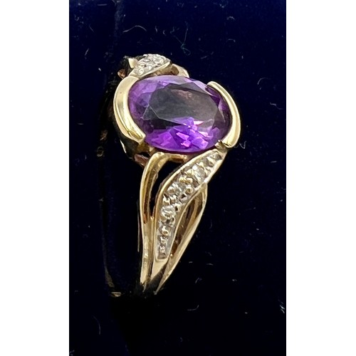 639 - A nine carat gold ring set with amethyst and diamonds. Size M, weight 2.3gm.