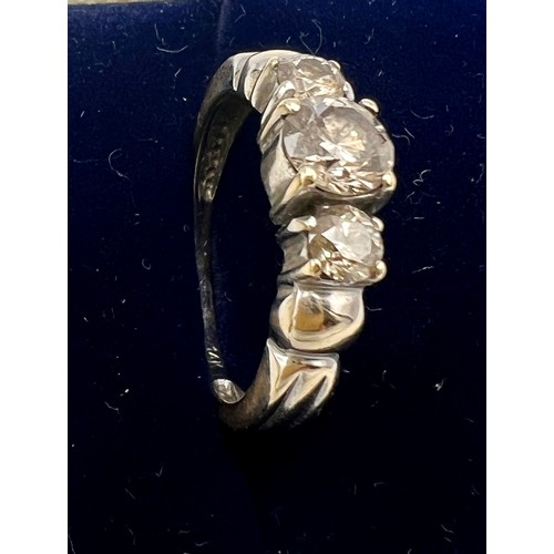 631 - A 14 carat gold and three stone diamond ring, size N/O. Weight 3.7gm.