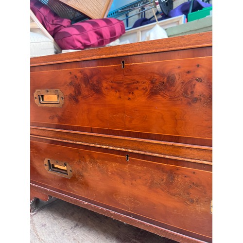 116 - A 20thC yew wood campaign chest on bracket feet. 92cm w x 41cm d x 93cm h.