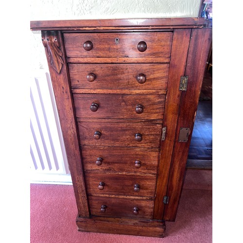 117 - A 19thC mahogany wellington chest of drawers. 48cm w x 34cm d x 103cm h.