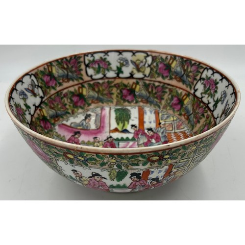 1055 - A 20thC Chinese porcelain hand painted famille rose bowl with oriental scenes of figures and foliate... 