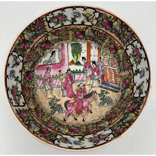 1055 - A 20thC Chinese porcelain hand painted famille rose bowl with oriental scenes of figures and foliate... 