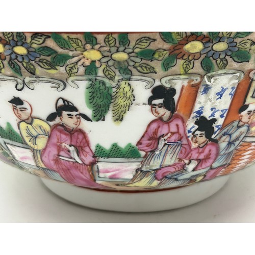 1055 - A 20thC Chinese porcelain hand painted famille rose bowl with oriental scenes of figures and foliate... 