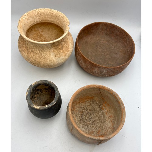 327 - Four old, possibly Roman pottery bowls. Tallest 9cm h.