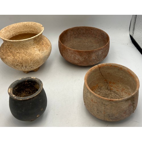 327 - Four old, possibly Roman pottery bowls. Tallest 9cm h.