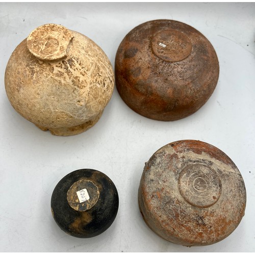 327 - Four old, possibly Roman pottery bowls. Tallest 9cm h.