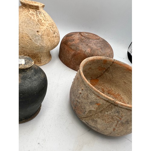 327 - Four old, possibly Roman pottery bowls. Tallest 9cm h.