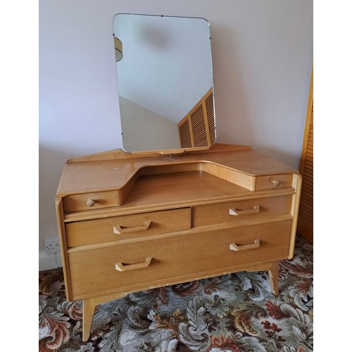 113 - A mid 20thC G Plan E Gomme bedroom suite comprising dressing table, 141cm h x 107cm w x 45cm d, 3 dr... 