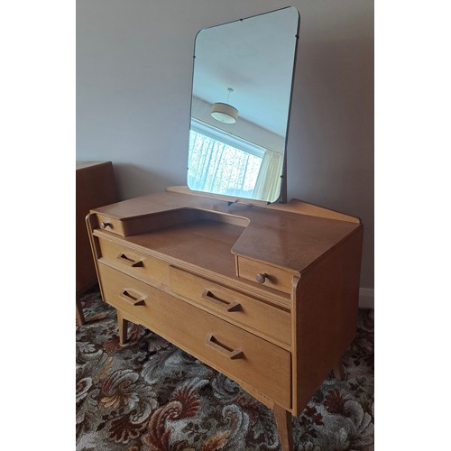 113 - A mid 20thC G Plan E Gomme bedroom suite comprising dressing table, 141cm h x 107cm w x 45cm d, 3 dr... 