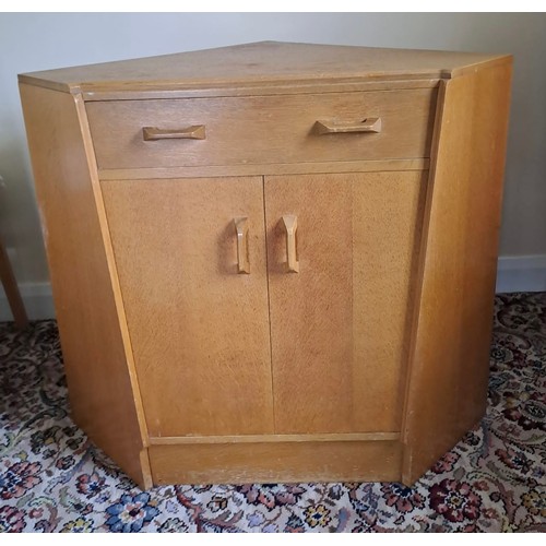 114 - A mid 20thC G Plan E Gomme corner cupboard with secretaire drawer to top. 80cm h x 70cm w x 65cm d.