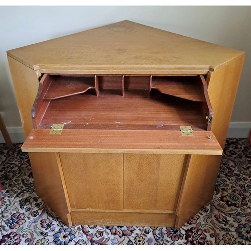 114 - A mid 20thC G Plan E Gomme corner cupboard with secretaire drawer to top. 80cm h x 70cm w x 65cm d.