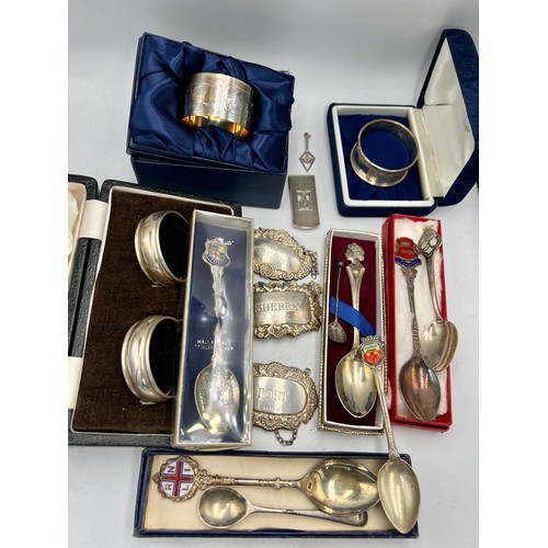 901 - A selection of various silver items to include 4 hallmarked silver napkins, 3 hallmarked silver deca... 