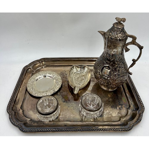 902 - Various items of white metal and silver to include silver topped glass salts, coffee pot, ashtray, t... 