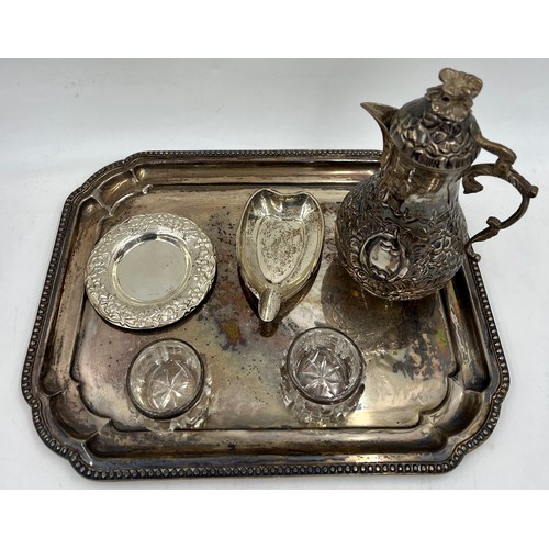 902 - Various items of white metal and silver to include silver topped glass salts, coffee pot, ashtray, t... 