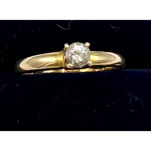 626 - A yellow metal solitaire diamond ring, size K. Weight 1.9gm.