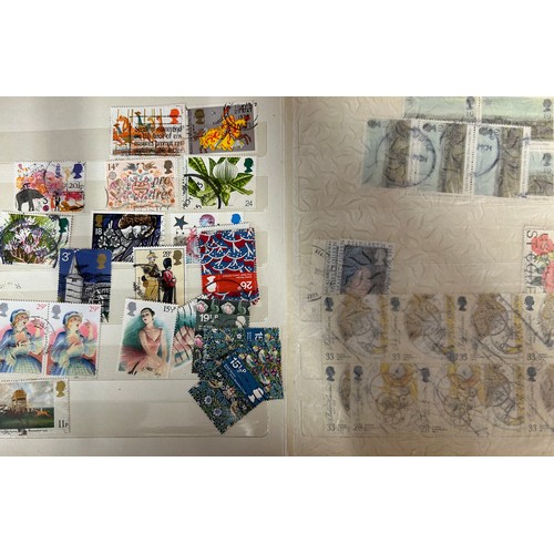 829 - An accumulation of GB and World Stamps both mint and used  to include four albums of GB stamps, the ... 