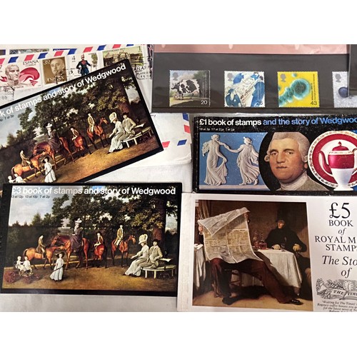 829 - An accumulation of GB and World Stamps both mint and used  to include four albums of GB stamps, the ... 