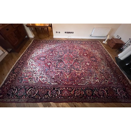 1283 - A very good quality red ground wool rug. 400 x 296cm without tassels.