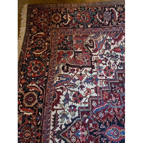 1283 - A very good quality red ground wool rug. 400 x 296cm without tassels.