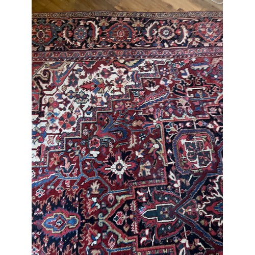 1283 - A very good quality red ground wool rug. 400 x 296cm without tassels.