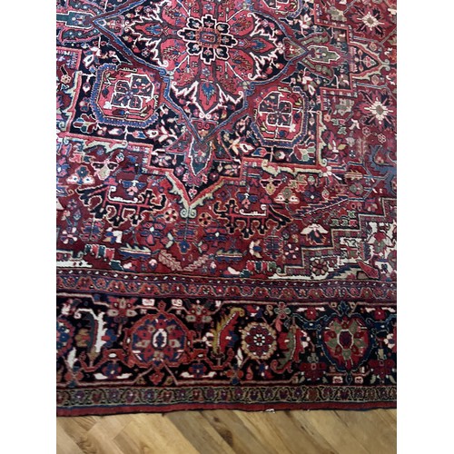 1283 - A very good quality red ground wool rug. 400 x 296cm without tassels.