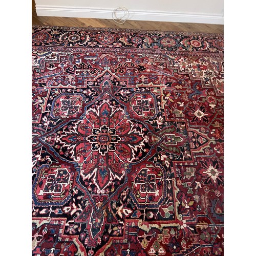 1283 - A very good quality red ground wool rug. 400 x 296cm without tassels.