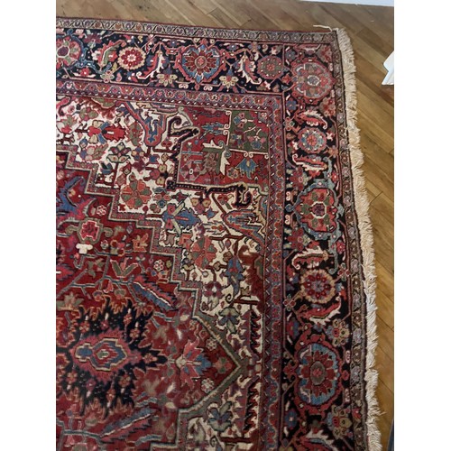 1283 - A very good quality red ground wool rug. 400 x 296cm without tassels.