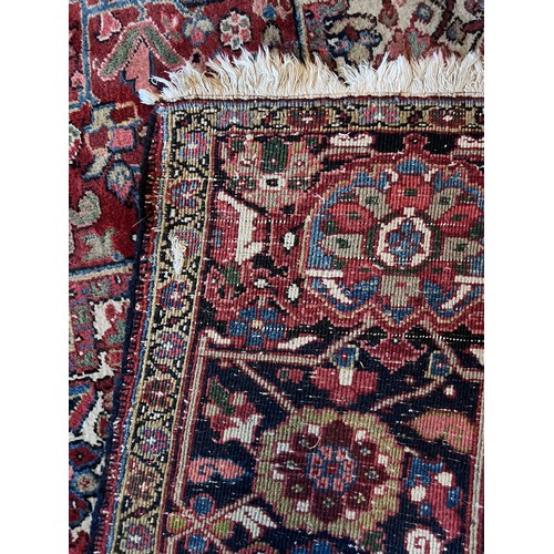 1283 - A very good quality red ground wool rug. 400 x 296cm without tassels.