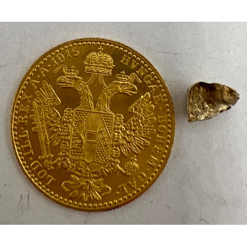 831 - An Austrian Frank Joseph I, 1915 gold one ducat together with small piece of gold. Total weight 4.2g... 